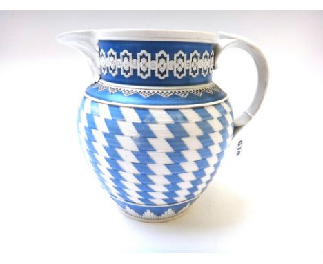A Spode feldspathic stoneware blue and white jug, early 19th century, the ovoid body engine turned with a chevron pattern, im