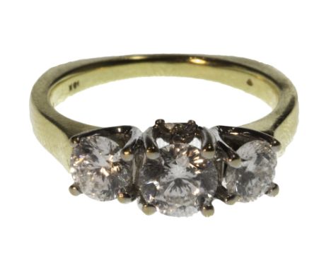 A gold and diamond set ring, claw set with a row of the three principal circular cut diamonds at the centre and with diamond 