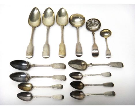 Silver fiddle pattern table flatware, comprising; a sugar sifting spoon, Exeter 1866, a sauce ladle, Exeter 1871, a cream lad