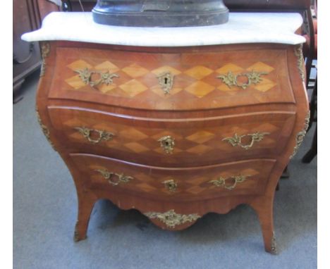 An 18th century style gilt metal mounted parquetry inlaid walnut marble topped bombe three drawer commode on splayed feet, 10