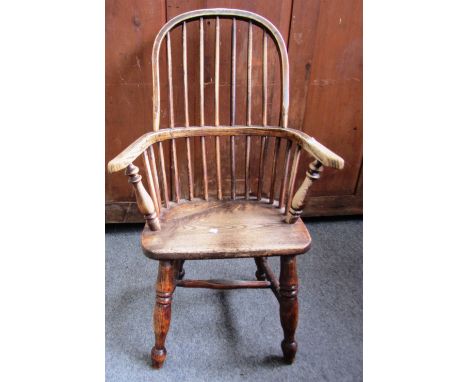 A child's ash and elm stick back Windsor chair on turned supports, 80cm high. 