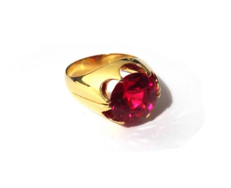A gold ring, mounted with a circular cut synthetic ruby, ring size N, gross weight 12 gms. 