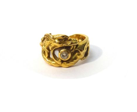 A French gold and diamond set single stone ring, designed as a dragon, bears indistinct number 4.00, ring size K, gross weigh