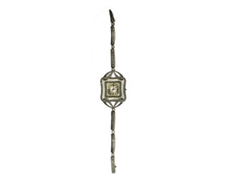 A lady's diamond set cocktail bracelet wristwatch, with an unsigned circular jeweled lever movement, the curved square silver