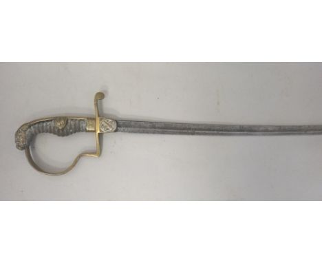 A German Imperial artillery officer's sable, 19th century, with slightly curved, engraved steel blade (75.5cm), brass stirrup