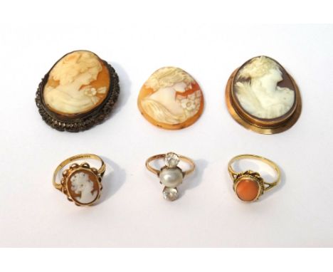 A colourless zircon and cultured pearl set ring, claw set with the cultured pearl at the centre, between two colourless zirco
