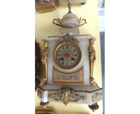 A Victorian onyx clock garniture with urn finial, the dial and body painted with floral cartouches with applied gilt metal em