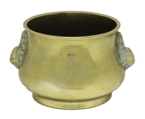A Chinese polished bronze censer, of squat bombé form with animal mask handles, seal mark to base, 12.5cm.wide.  Illustrated
