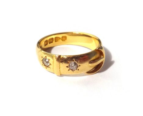 A Victorian 18ct gold and diamond set two stone ring, in a buckle and strap design, mounted with cushion shaped diamonds, Che