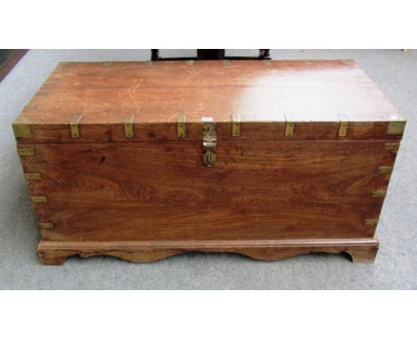 A 19th century metal bound Indian teak rectangular trunk on bracket feet, 122cm wide.