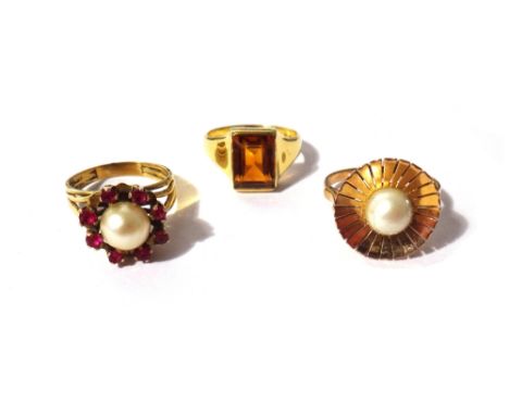 An 18ct gold ring, mounted with a rectangular cut citrine, a gold ring mounted with an imitation pearl and a gold ring mounte