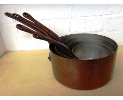 A set of five French graduated copper and cast iron saucepans, early 20th century, the largest (20.5cm) stamped 'Havard Made 