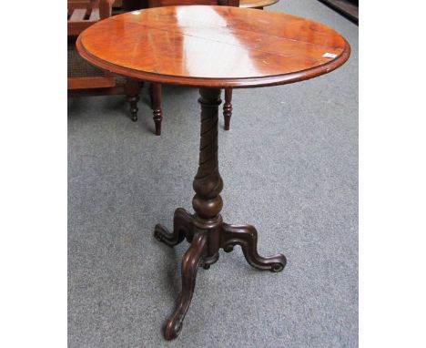 A Victorian figured walnut oval drop flap occasional table on spiral fluted tripod base, 61cm wide.