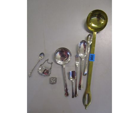 A small group of silver and silver plate to include a Brandy wine label, a small continental pill box and a brass ladle