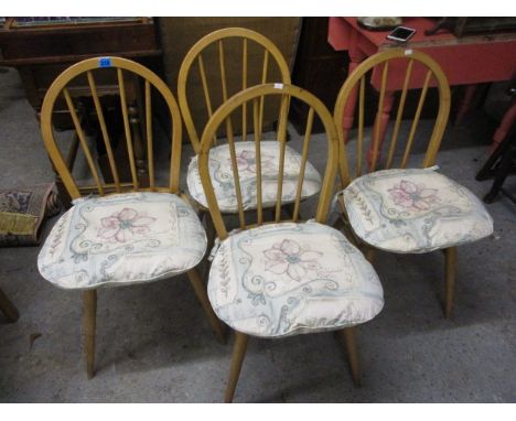 Four Ercol beech stick back chairs