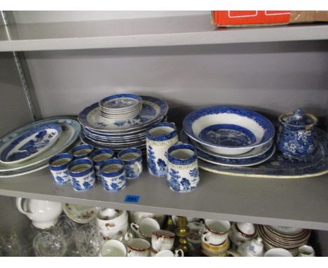A collection of blue and white ceramics to include Willow coffee cans, saucers and other items