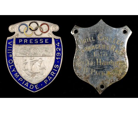 OLYMPIC GAMES, PARIS 1924.? A PLATED METAL AND BLUE ENAMEL PRESS BADGE OF THE EIGHTH OLYMPIAD, SHIELD SHAPED, THE REVERSE STA