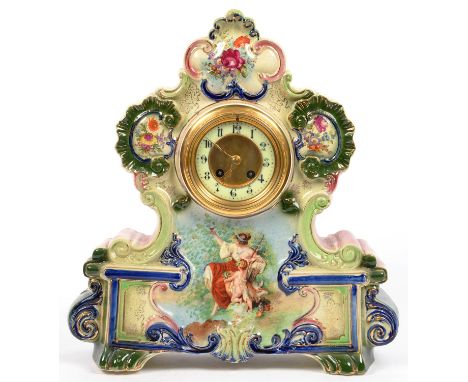 A CONTINENTAL PAINTED EARTHENWARE MANTEL CLOCK WITH ENAMEL DIAL, 45CM H 