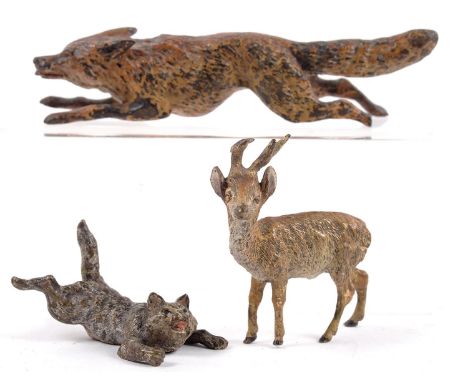 THREE COLD PAINTED BRONZE MINIATURE SCULPTURES OF ANIMALS, COMPRISING RUNNING FOX (LACKING ONE BACK FOOT), STAG AND CLIMBING 