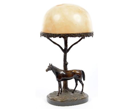 A BRONZE TABLE LAMP IN THE FORM OF A STALLION STANDING BEFORE A TREE, DOMED ALABASTER SHADE, ON SLATE BASE, 53CM H 