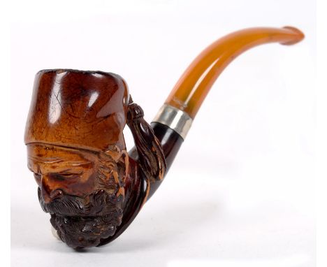 A CARVED AND STAINED MEERSCHAUM TOBACCO PIPE, THE BOWL AS THE HEAD OF AN ARAB MAN WITH AMBER COLOURED MOUTHPIECE, 11CM L 