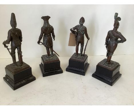 Set of 4 early C20th bronze military statuettes, dated 1700, 1800 &amp; 1900 x 2, on wooden plinth, bronzes 20cm high and sma