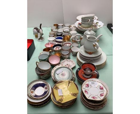 A qty of cabinet porcelain tea cups, coffee cans and saucers, 14 Rosenthal fruit pattern dessert plates and Limoges 6 person 