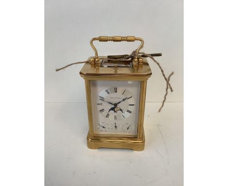 Brass cased carriage clock by Matthew Norman of London, no 1781,  the dial with lunar apertures and 3 other subsidiary dials 