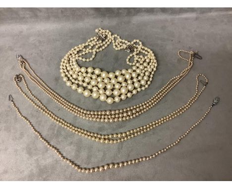 Single strand graduated pearl necklace 40 inches Long, a 3 strand graduated pearl necklace 40 inches long, four strand gradua