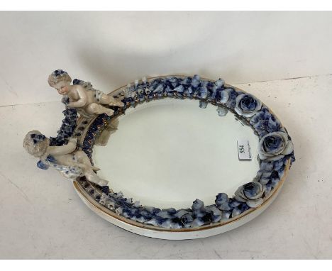 Continental porcelain framed small oval wall mirror with cherub finials,  blue Sitzendorf marks (behind cherubs) 33 cm H over