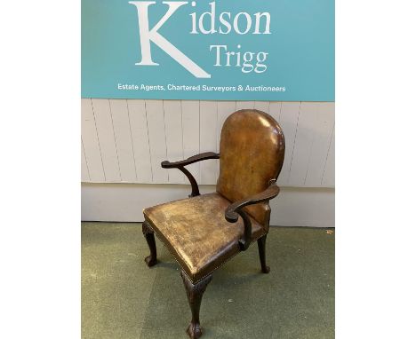 C19th mahogany library armchair on cabriole legs to ball and claw feet upholstered in good vintage tan leather. Condition lea