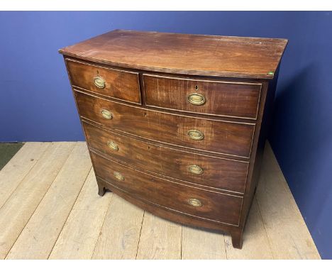 Early Victorian bow front chest of 2 short over 3 long graduated drawers with brass drop handles on splayed bracket feet  104