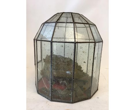 A vintage lead glazed Teranium  35cm high (some damage to glass, one pane missing) 