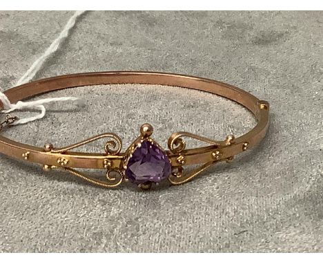 Heart faceted amethyst set Edwardian bangle, 9 carat yellow gold claw set mount to a flat hollow hinged mount with a box snap