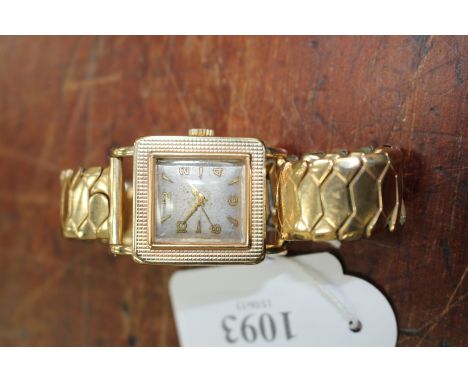 A ROTARY 9 CARAT GOLD GENTLEMAN'S WRISTWATCH with square dial, Arabic numerals dispersed among hour batons, the case with eng