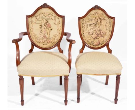 A SET OF EIGHT MAHOGANY TAPESTRY INSET BACK DINING CHAIRS with overstuffed upholstered seats and standing on reeded tapering 