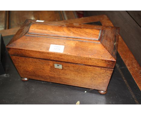 A GEORGE IV ROSEWOOD TEA CADDY of sarcophagus form with fitted interior, glass sugar bowl and all standing on bun feet, 30.5c