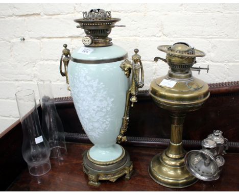 A HINKS PATENT NO. 2 DUPLEX PORCELAIN GILT MOUNTED OIL LAMP, 45cm in height together with a brass oil lamp and a Lucas bicycl