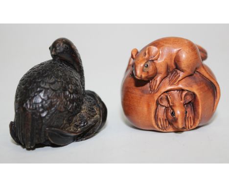 A SMALL CARVED BOXWOOD NETSUKE with two mice around a peach, bearing signatures on the base, 3.5cm high, together with a furt