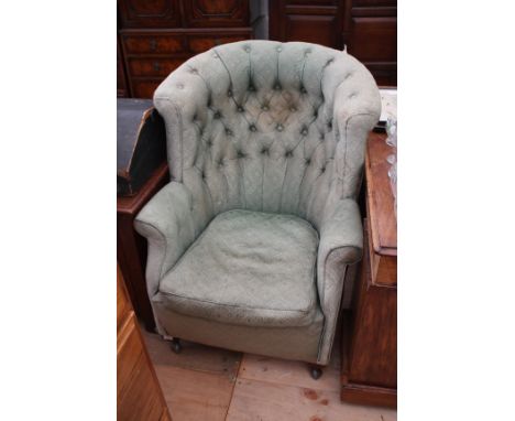 A VICTORIAN BUTTON BACK UPHOLSTERED ARMCHAIR