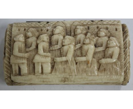 AN ANTIQUE BONE SNUFF BOX, the lid, back and sides carved with various figures in low relief (AF)