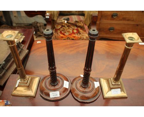 A PAIR OF GEORGIAN TURNED MAHOGANY TABLE CANDLESTICKS (AF), each approximately 28cm tall together with a pair of 19th century