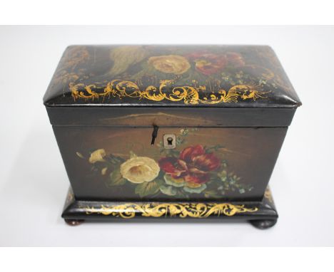 A VICTORIAN PAPIER MACHE TEA CADDY decorated with exotic birds and flowers, the rectangular tapering body on a plinth base an