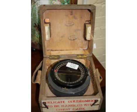 A TYPE E9 MILITARY ISSUE BUBBLE COMPASS, housed within a pine box