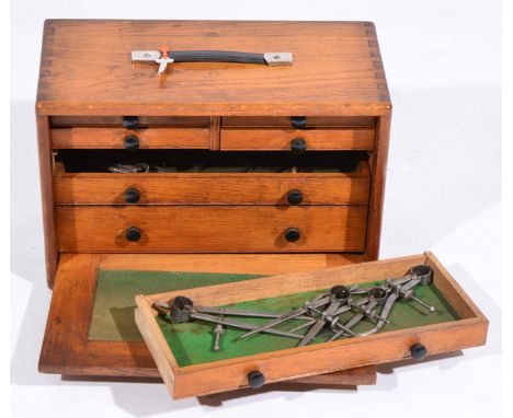 AN OAK ENGINEERS TOOL BOX, with eleven various drawers containing various tools, callipers, small vices etc 41.5cm wide