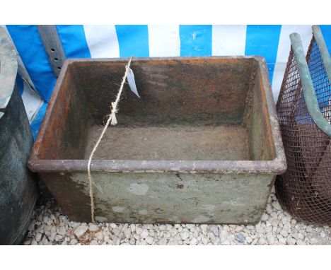 A SMALL OLD CAST IRON WATER TROUGH, 48cm wide x 25.5cm high