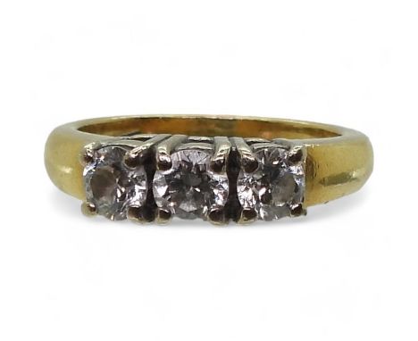 An 18ct gold three stone diamond ring, set with estimated approx 0.75cts, finger size K1/2, weight 5.5gms Condition Report:Av
