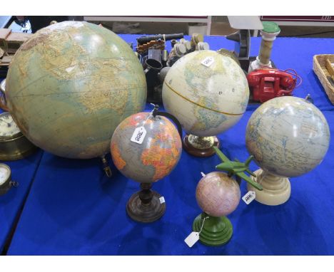 Five globes of varying scale, to include a "Geographia" 10 Inch Terrestrial Globe, a suspended Philips' 19 Inch Relief Globe,