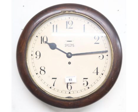 A 20th century Smiths 8 day station style circular wall clock with white painted dial bearing Arabic numerals, 30cm diameter 