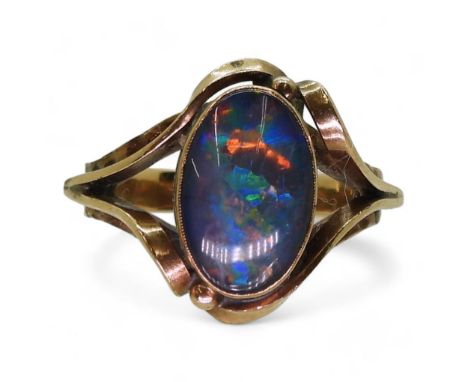 A 10K gold ring set with an opal doublet, size O1/2, weight 4.5gms Condition Report:Available upon request